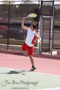 Great Bend Invitiational Boys Tennis Tournament A Liberal player serves the ball during the Great Bend Invitiational Boys Tennis Tournament at Great Bend High School in Great Bend, Kansas on March 31, 2012. (Photo: Joey Bahr, www.joeybahr.com)