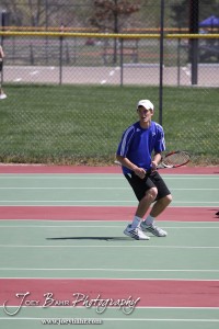 Great Bend Invitiational Boys Tennis Tournament An Ellinwood player watches as his teammate serves the ball during the Great Bend Invitiational Boys Tennis Tournament at Great Bend High School in Great Bend, Kansas on March 31, 2012. (Photo: Joey Bahr, www.joeybahr.com)