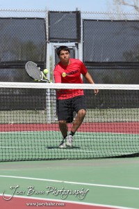 Great Bend Invitiational Boys Tennis Tournament A Great Bend player returns a volley during the Great Bend Invitiational Boys Tennis Tournament at Great Bend High School in Great Bend, Kansas on March 31, 2012. (Photo: Joey Bahr, www.joeybahr.com)