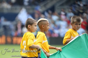 Sporting_KC_vs_LA_Galaxy_4-7-12_0415 Young soccer players carry a FIFA flag onto the field for the pre-match ceremonies at LIVESTRONG Sporting Park in Kansas City, Kansas on April 7, 2012. (Photo: Joey Bahr, www.joeybahr.com)