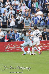 Sporting_KC_vs_LA_Galaxy_4-7-12_0449 Forward Kei Kamara (#23) of Sporting Kansas City threads his way through the LA Galaxy defense at LIVESTRONG Sporting Park in Kansas City, Kansas on April 7, 2012. (Photo: Joey Bahr, www.joeybahr.com)