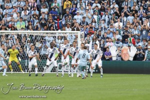 Sporting_KC_vs_LA_Galaxy_4-7-12_0471 Sporting Kansas City Midfielder Graham Zusi (#8) sends a free kick towards the LA Galaxy wall at LIVESTRONG Sporting Park in Kansas City, Kansas on April 7, 2012. (Photo: Joey Bahr, www.joeybahr.com)