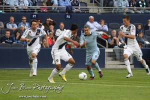 Sporting_KC_vs_LA_Galaxy_4-7-12_0831 Sporting Kansas City Midfielder Graham Zusi (#8) drives through the LA Galaxy defense at LIVESTRONG Sporting Park in Kansas City, Kansas on April 7, 2012. (Photo: Joey Bahr, www.joeybahr.com)