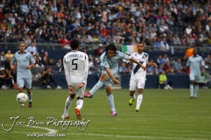 Sporting_KC_vs_LA_Galaxy_4-7-12_0842 Sporting Kansas City Midfielder Roger Espinoza (#15) fires a shot against LA Galaxy at LIVESTRONG Sporting Park in Kansas City, Kansas on April 7, 2012. (Photo: Joey Bahr, www.joeybahr.com)