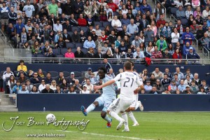 Sporting_KC_vs_LA_Galaxy_4-7-12_0886 Sporting Kansas City Forward Kei Kamara (#23) fires a shot past LA Galaxy Defender Tommy Meyer (#21) at LIVESTRONG Sporting Park in Kansas City, Kansas on April 7, 2012. (Photo: Joey Bahr, www.joeybahr.com)