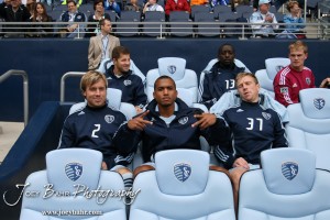 Sporting_KC_vs_LA_Galaxy_4-7-12_1054 Substitutes Defender Michael Harrington (#2), Forward Teal Bunbury (#9), and Forward Jacob Peterson (#37) prepare for the match against LA Galaxy to begin at LIVESTRONG Sporting Park in Kansas City, Kansas on April 7, 2012. (Photo: Joey Bahr, www.joeybahr.com)