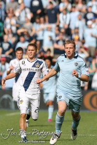 Sporting_KC_vs_LA_Galaxy_4-7-12_1163 Sporting Kansas City Midfielder Luke Sassano (#32) and LA Galaxy Midfielder Michael Stephens (#26) race down the field at LIVESTRONG Sporting Park in Kansas City, Kansas on April 7, 2012. (Photo: Joey Bahr, www.joeybahr.com)