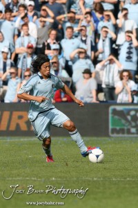 Sporting_KC_vs_LA_Galaxy_4-7-12_1169 Sporting Kansas City Midfielder Roger Espinoza (#15) kicks the ball against LA Galaxy at LIVESTRONG Sporting Park in Kansas City, Kansas on April 7, 2012. (Photo: Joey Bahr, www.joeybahr.com)