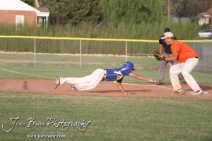 KSHSAA 4A Regional Baseball Championship Nickerson Panther Jake Stiverson (#4) dives towards First Base to beat a throw caught by Colby Eagle Braden Sager (#9) at the KSHSAA 4A Regional Baseball Championship at Legion Field in Hoisington, Kansas on May 16, 2012. (Photo: Joey Bahr, www.joeybahr.com)