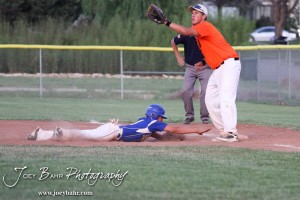 KSHSAA 4A Regional Baseball Championship Jake Stiverson (#4) of the Nickerson Panthers dives to first as Colby Eagle Braden Sager (#9) tries to catch the ball at the KSHSAA 4A Regional Baseball Championship at Legion Field in Hoisington, Kansas on May 16, 2012. (Photo: Joey Bahr, www.joeybahr.com)