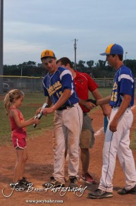 KSHSAA 4A Regional Baseball Championship Nickerson Panther Seniors Quintin Crandall (#11) and Justin Engelland (#15) receive the 4A Regional Baseball Championship plaque after their 4-1 victory over the Colby Eagles at the KSHSAA 4A Regional Baseball Championship at Legion Field in Hoisington, Kansas on May 16, 2012. (Photo: Joey Bahr, www.joeybahr.com)