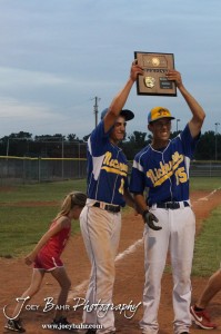 KSHSAA 4A Regional Baseball Championship Nickerson Panther Seniors Quintin Crandall (#11) and Justin Engelland (#15) hold up the 4A Regional Baseball Championship plaque after their 4-1 victory over the Colby Eagles at the KSHSAA 4A Regional Baseball Championship at Legion Field in Hoisington, Kansas on May 16, 2012. (Photo: Joey Bahr, www.joeybahr.com)
