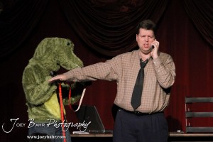 Gator Creature/Phil played by Lynn Benefield measures Lester played by Jeff Gibson during the Great Bend Community Theater's final rehearsal of "Duck Hunter Shoots Angel" by Mitch Albom at Crest Theater in Great Bend, Kansas on April 17, 2013. (Photo: Joey Bahr, www.joeybahr.com)