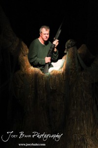 Duwell played by Charlie Dixon sits in a tree during the Great Bend Community Theater's final rehearsal of "Duck Hunter Shoots Angel" by Mitch Albom at Crest Theater in Great Bend, Kansas on April 17, 2013. (Photo: Joey Bahr, www.joeybahr.com)