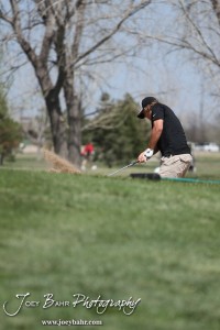 Great Bend Panther Matt Marshall hits out of the bunker during the Great Bend High School Boys Golf Invitational Tournament at The Club at Stoneridge in Great Bend, Kansas on April 29, 2013. (Photo: Joey Bahr, www.joeybahr.com)