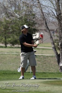 Great Bend Panther Matt Marshall watches the ball after chipping during the Great Bend High School Boys Golf Invitational Tournament at The Club at Stoneridge in Great Bend, Kansas on April 29, 2013. (Photo: Joey Bahr, www.joeybahr.com)