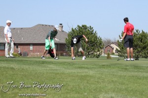 Great Bend Panther Matt Marshall reaches for his ball during the Great Bend High School Boys Golf Invitational Tournament at The Club at Stoneridge in Great Bend, Kansas on April 29, 2013. (Photo: Joey Bahr, www.joeybahr.com)