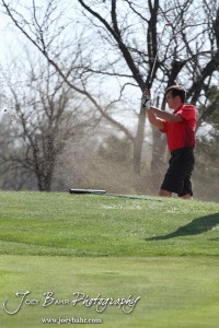 Liberal Redskin Blake Brenneman hits the ball out of the bunker during the Great Bend High School Boys Golf Invitational Tournament at The Club at Stoneridge in Great Bend, Kansas on April 29, 2013. (Photo: Joey Bahr, www.joeybahr.com)
