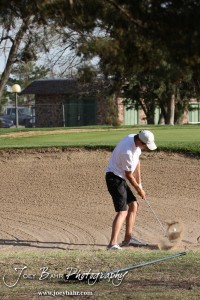 A Garden City Buffalo hits the ball out of the bunker during the Great Bend High School Boys Golf Invitational Tournament at The Club at Stoneridge in Great Bend, Kansas on April 29, 2013. (Photo: Joey Bahr, www.joeybahr.com)