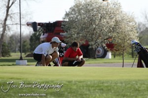 Two players try to ready the green during the Great Bend High School Boys Golf Invitational Tournament at The Club at Stoneridge in Great Bend, Kansas on April 29, 2013. (Photo: Joey Bahr, www.joeybahr.com)
