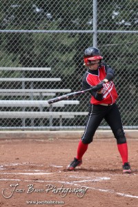 A Great Bend Lady Panther swings at an oncoming pitch during the Liberal Lady Redskins at Great Bend Lady Panthers Softball Double Header with Great Bend winning both games 18-0 (3 innings) 13-0 at Barton Community College Softball Field in Great Bend, Kansas on April 27, 2013. (Photo: Joey Bahr, www.joeybahr.com)