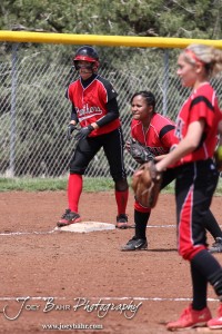 A Great Bend Lady Panther watches the Pitcher from Third Base during the Liberal Lady Redskins at Great Bend Lady Panthers Softball Double Header with Great Bend winning both games 18-0 (3 innings) 13-0 at Barton Community College Softball Field in Great Bend, Kansas on April 27, 2013. (Photo: Joey Bahr, www.joeybahr.com)