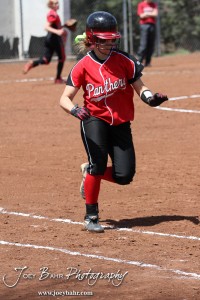 A Great Bend Lady Panther runs to First Base during the Liberal Lady Redskins at Great Bend Lady Panthers Softball Double Header with Great Bend winning both games 18-0 (3 innings) 13-0 at Barton Community College Softball Field in Great Bend, Kansas on April 27, 2013. (Photo: Joey Bahr, www.joeybahr.com)
