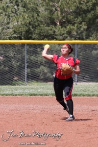 Liberal Lady Redskin Cynthia Cisneros (#5) throws the ball to First Base during Liberal Lady Redskins at Great Bend Lady Panthers Softball Double Header with Great Bend winning both games 18-0 (3 innings) 13-0 at Barton Community College Softball Field in Great Bend, Kansas on April 27, 2013. (Photo: Joey Bahr, www.joeybahr.com)