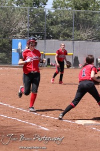 A Great Bend Lady Panther runs to First during the Liberal Lady Redskins at Great Bend Lady Panthers Softball Double Header with Great Bend winning both games 18-0 (3 innings) 13-0 at Barton Community College Softball Field in Great Bend, Kansas on April 27, 2013. (Photo: Joey Bahr, www.joeybahr.com)