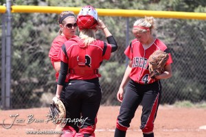 The Liberal Lady Redskins Head Coach Pat Knott talks to her players during the Liberal Lady Redskins at Great Bend Lady Panthers Softball Double Header with Great Bend winning both games 18-0 (3 innings) 13-0 at Barton Community College Softball Field in Great Bend, Kansas on April 27, 2013. (Photo: Joey Bahr, www.joeybahr.com)