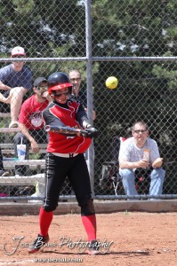 A Great Bend Lady Panther hits the ball during the Liberal Lady Redskins at Great Bend Lady Panthers Softball Double Header with Great Bend winning both games 18-0 (3 innings) 13-0 at Barton Community College Softball Field in Great Bend, Kansas on April 27, 2013. (Photo: Joey Bahr, www.joeybahr.com)