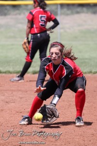A Great Bend Lady Panther fields a ball as part of warmups during the Liberal Lady Redskins at Great Bend Lady Panthers Softball Double Header with Great Bend winning both games 18-0 (3 innings) 13-0 at Barton Community College Softball Field in Great Bend, Kansas on April 27, 2013. (Photo: Joey Bahr, www.joeybahr.com)