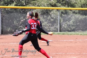 Great Bend Lady Panther Pitcher Hunter Middleton (#33) winds up her pitch during the Liberal Lady Redskins at Great Bend Lady Panthers Softball Double Header with Great Bend winning both games 18-0 (3 innings) 13-0 at Barton Community College Softball Field in Great Bend, Kansas on April 27, 2013. (Photo: Joey Bahr, www.joeybahr.com)