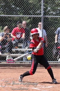 A Liberal Lady Redskin swings at a pitch during the Liberal Lady Redskins at Great Bend Lady Panthers Softball Double Header with Great Bend winning both games 18-0 (3 innings) 13-0 at Barton Community College Softball Field in Great Bend, Kansas on April 27, 2013. (Photo: Joey Bahr, www.joeybahr.com)