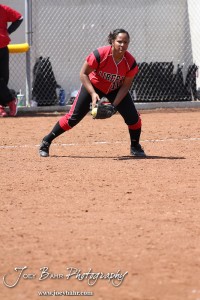 Liberal Lady Redskin Alyssa Tatro fields a ball while warming up between innings during the Liberal Lady Redskins at Great Bend Lady Panthers Softball Double Header with Great Bend winning both games 18-0 (3 innings) 13-0 at Barton Community College Softball Field in Great Bend, Kansas on April 27, 2013. (Photo: Joey Bahr, www.joeybahr.com)