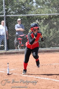 Great Bend Lady Panther Kaylie Doll (#20) runs down the First Base Line during the Liberal Lady Redskins at Great Bend Lady Panthers Softball Double Header with Great Bend winning both games 18-0 (3 innings) 13-0 at Barton Community College Softball Field in Great Bend, Kansas on April 27, 2013. (Photo: Joey Bahr, www.joeybahr.com)