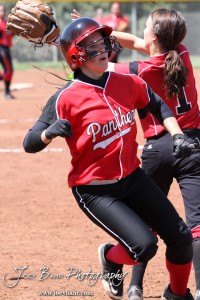 Great Bend Lady Panther Kaylie Doll (#20) tries to beat the throw to first being covered by Liberal Lady Redskin Riley Hay (#1) during the Liberal Lady Redskins at Great Bend Lady Panthers Softball Double Header with Great Bend winning both games 18-0 (3 innings) 13-0 at Barton Community College Softball Field in Great Bend, Kansas on April 27, 2013. (Photo: Joey Bahr, www.joeybahr.com)