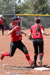 A Great Bend Lady Panther tries to beat a throw to First during the Liberal Lady Redskins at Great Bend Lady Panthers Softball Double Header with Great Bend winning both games 18-0 (3 innings) 13-0 at Barton Community College Softball Field in Great Bend, Kansas on April 27, 2013. (Photo: Joey Bahr, www.joeybahr.com)