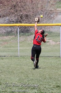 Liberal Lady Redskin Ilse Rosales (#13) chases after a fly ball during the Liberal Lady Redskins at Great Bend Lady Panthers Softball Double Header with Great Bend winning both games 18-0 (3 innings) 13-0 at Barton Community College Softball Field in Great Bend, Kansas on April 27, 2013. (Photo: Joey Bahr, www.joeybahr.com)