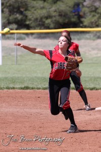 Liberal Lady Redskin Riley Hay (#1) throws a ball to First during the Liberal Lady Redskins at Great Bend Lady Panthers Softball Double Header with Great Bend winning both games 18-0 (3 innings) 13-0 at Barton Community College Softball Field in Great Bend, Kansas on April 27, 2013. (Photo: Joey Bahr, www.joeybahr.com)