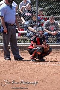 The Great Bend Lady Panther Catcher watches for the pitch signal from the dugout during the Liberal Lady Redskins at Great Bend Lady Panthers Softball Double Header with Great Bend winning both games 18-0 (3 innings) 13-0 at Barton Community College Softball Field in Great Bend, Kansas on April 27, 2013. (Photo: Joey Bahr, www.joeybahr.com)