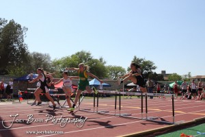 Girls jump over the first hurdle in the 100 Meter Hurdle Preliminaries during the 2013 KSHSAA Class 1A Regional Track and Field competition at Lewis Field on the campus of Fort Hays State University in Hays, Kansas on May 17, 2013. (Photo: Joey Bahr, www.joeybahr.com)