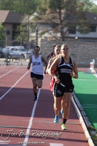 A Wheatland-Grinnell runner leads the pack in the Girls 4x800 Meter Relay during the 2013 KSHSAA Class 1A Regional Track and Field competition at Lewis Field on the campus of Fort Hays State University in Hays, Kansas on May 17, 2013. (Photo: Joey Bahr, www.joeybahr.com)