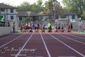 Competitors in the Girls 100 Meter Dash Finals launch out of the blocks during the 2013 KSHSAA Class 1A Regional Track and Field competition at Lewis Field on the campus of Fort Hays State University in Hays, Kansas on May 17, 2013. (Photo: Joey Bahr, www.joeybahr.com)