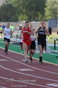 Runners from Greeley County and Wheatland-Grinnell lead the pack in the Girls 1600 Meter Run during the 2013 KSHSAA Class 1A Regional Track and Field competition at Lewis Field on the campus of Fort Hays State University in Hays, Kansas on May 17, 2013. (Photo: Joey Bahr, www.joeybahr.com)