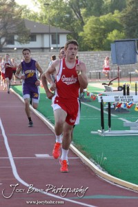 A Greeley County runner leads the field in the Boys 1600 Meter Run during the 2013 KSHSAA Class 1A Regional Track and Field competition at Lewis Field on the campus of Fort Hays State University in Hays, Kansas on May 17, 2013. (Photo: Joey Bahr, www.joeybahr.com)