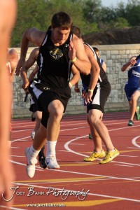 A LaCrosse runner starts to run as the baton nears in the 4x100 Meter Relay during the 2013 KSHSAA Class 1A Regional Track and Field competition at Lewis Field on the campus of Fort Hays State University in Hays, Kansas on May 17, 2013. (Photo: Joey Bahr, www.joeybahr.com)