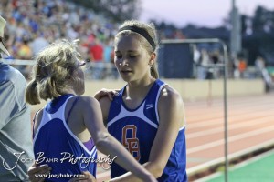 Otis-Bison's Hannah Bannister greets Fiona Conley after their 3200 Meter run during the 2013 KSHSAA Class 1A Regional Track and Field competition at Lewis Field on the campus of Fort Hays State University in Hays, Kansas on May 17, 2013. (Photo: Joey Bahr, www.joeybahr.com)