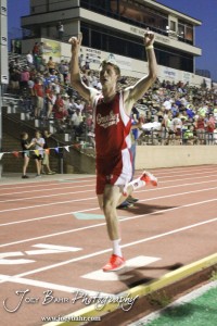 A Greeley County runner celebrates his First Place in the Boys 3200 Meter Run during the 2013 KSHSAA Class 1A Regional Track and Field competition at Lewis Field on the campus of Fort Hays State University in Hays, Kansas on May 17, 2013. (Photo: Joey Bahr, www.joeybahr.com)
