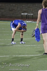 A student shows his disappointment at the end of the 2013 KSHSAA Class 1A Regional Track and Field competition at Lewis Field on the campus of Fort Hays State University in Hays, Kansas on May 17, 2013. (Photo: Joey Bahr, www.joeybahr.com)